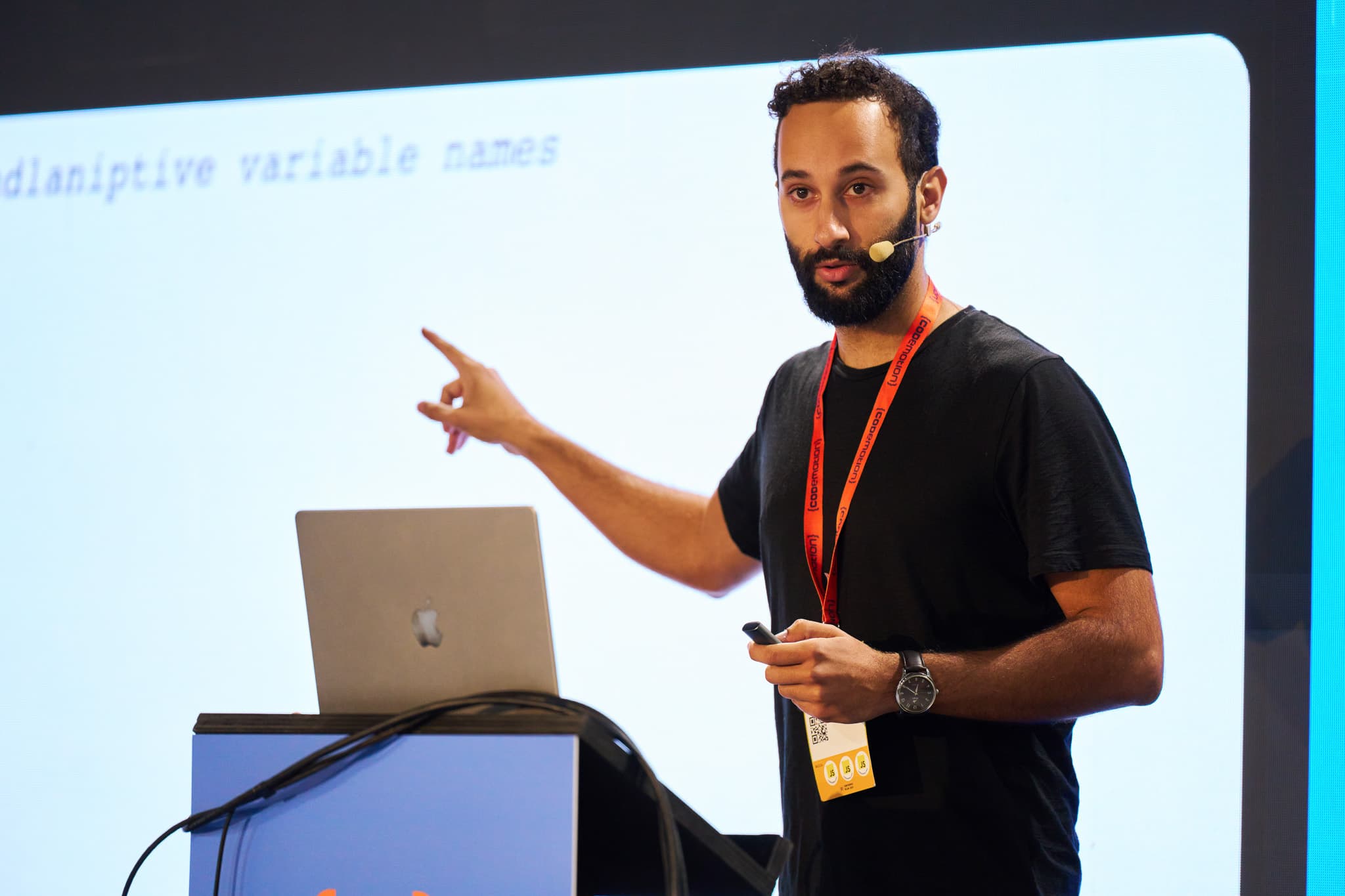 César speaking at a conference
