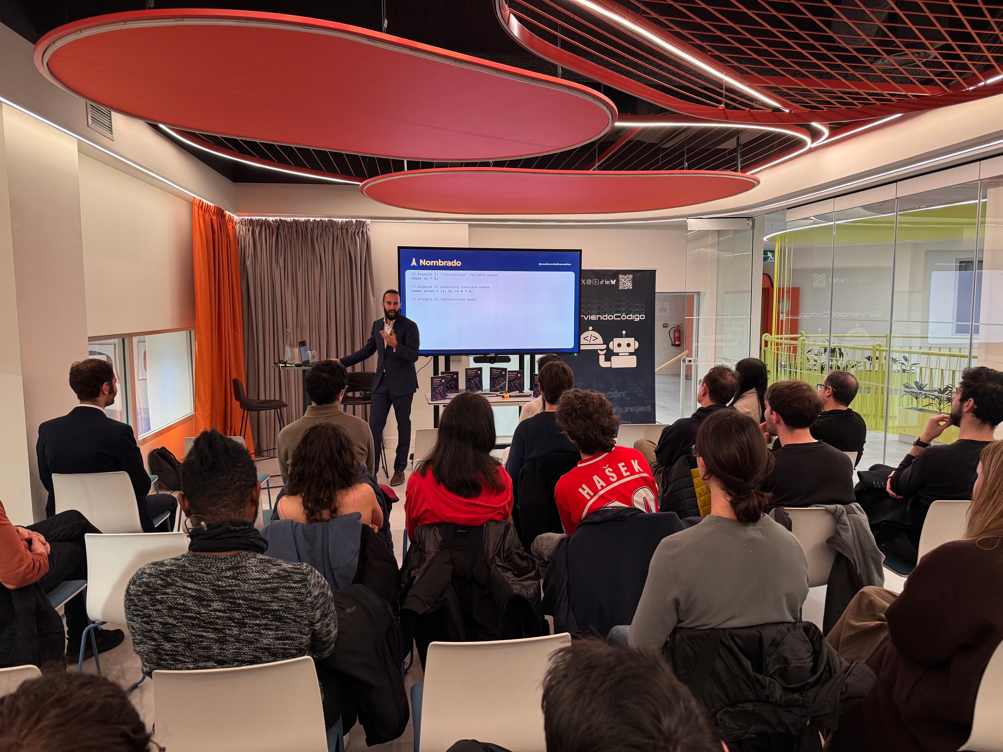 César speaking at an event